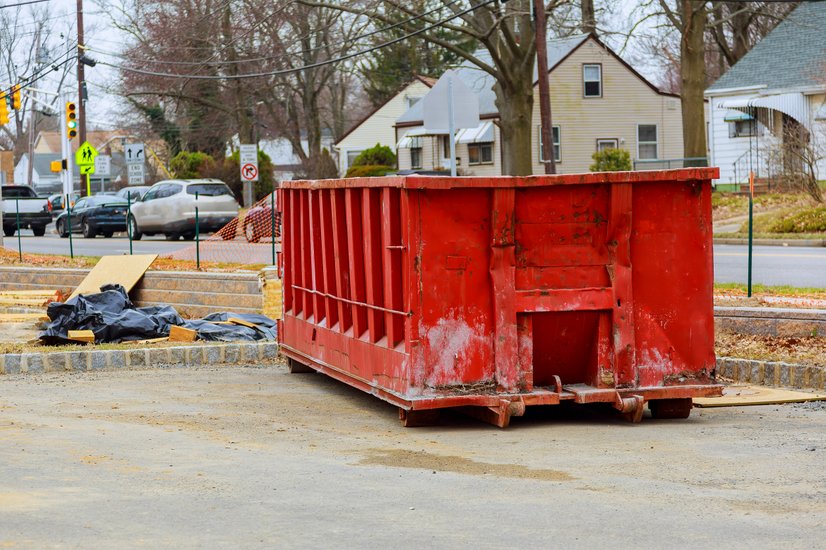 dumpster on parking lot